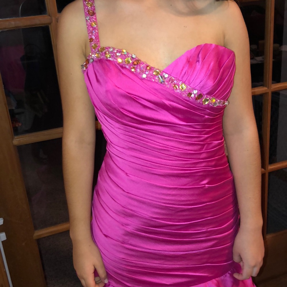 Pink bejeweled prom dress.